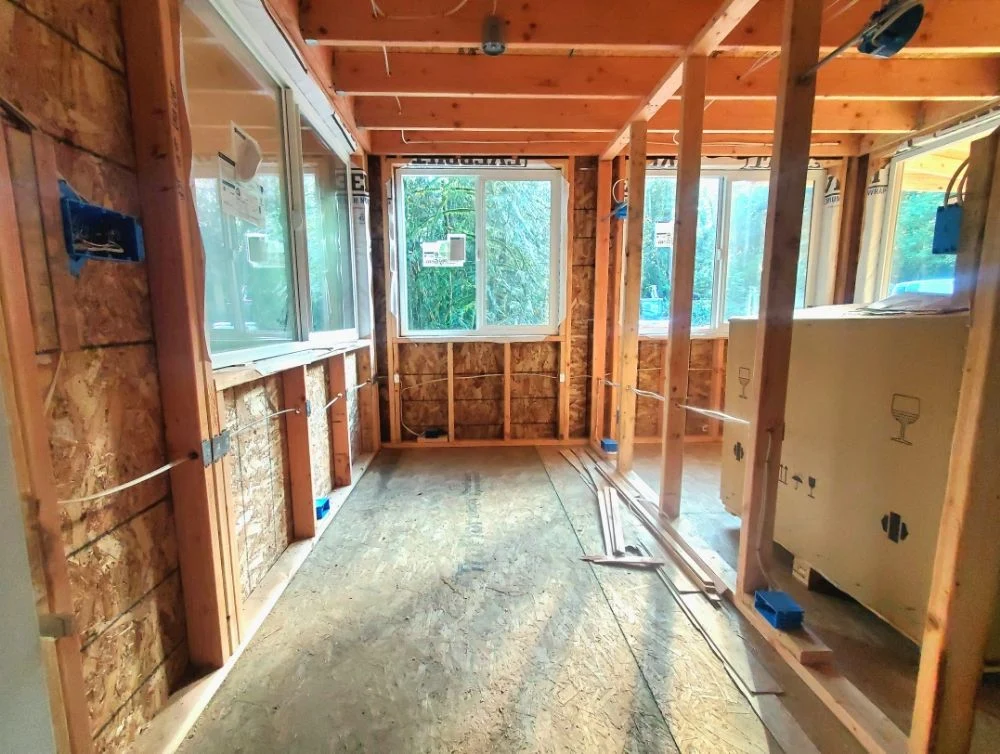 Open walls wired with new cable by Washington Electrical