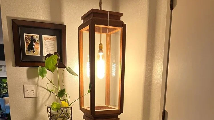 Lantern-style light fixture installed in a home entryway