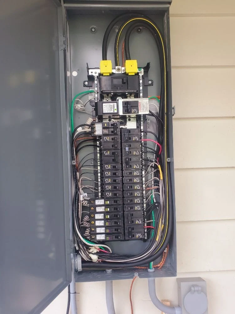 Open electrical panel showing breakers and wiring