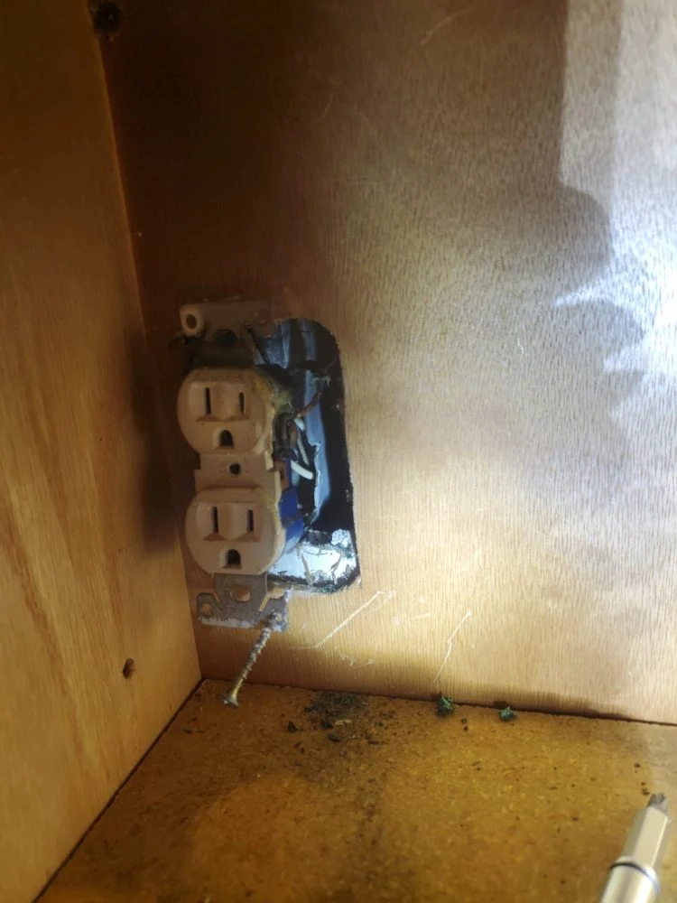 Outlet replaced after a fire-risk install that lacked a proper electrical box