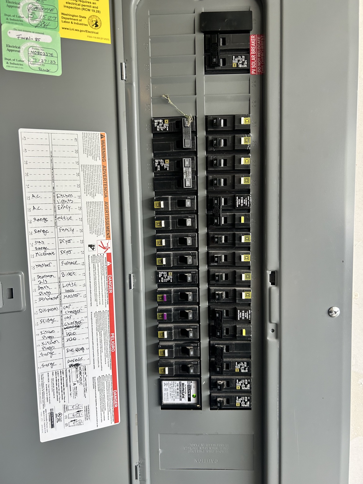 Square D panel interior with labeled directory and surge breaker installed by Washington Electrical