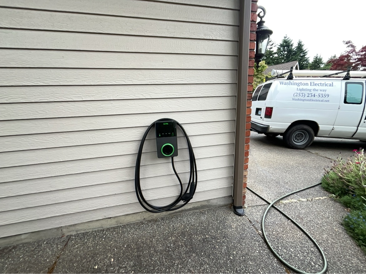 Autel EV charger installed on a house with the Washington Electrical van in the driveway