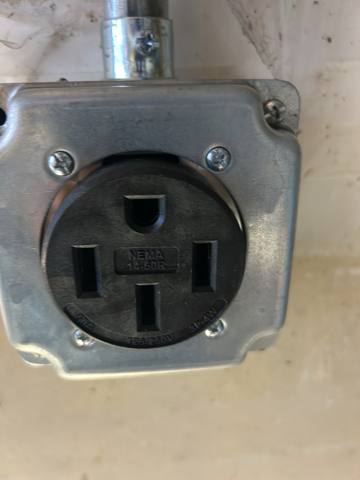 NEMA 14-50 outlet installed in a metal box by Washington Electrical